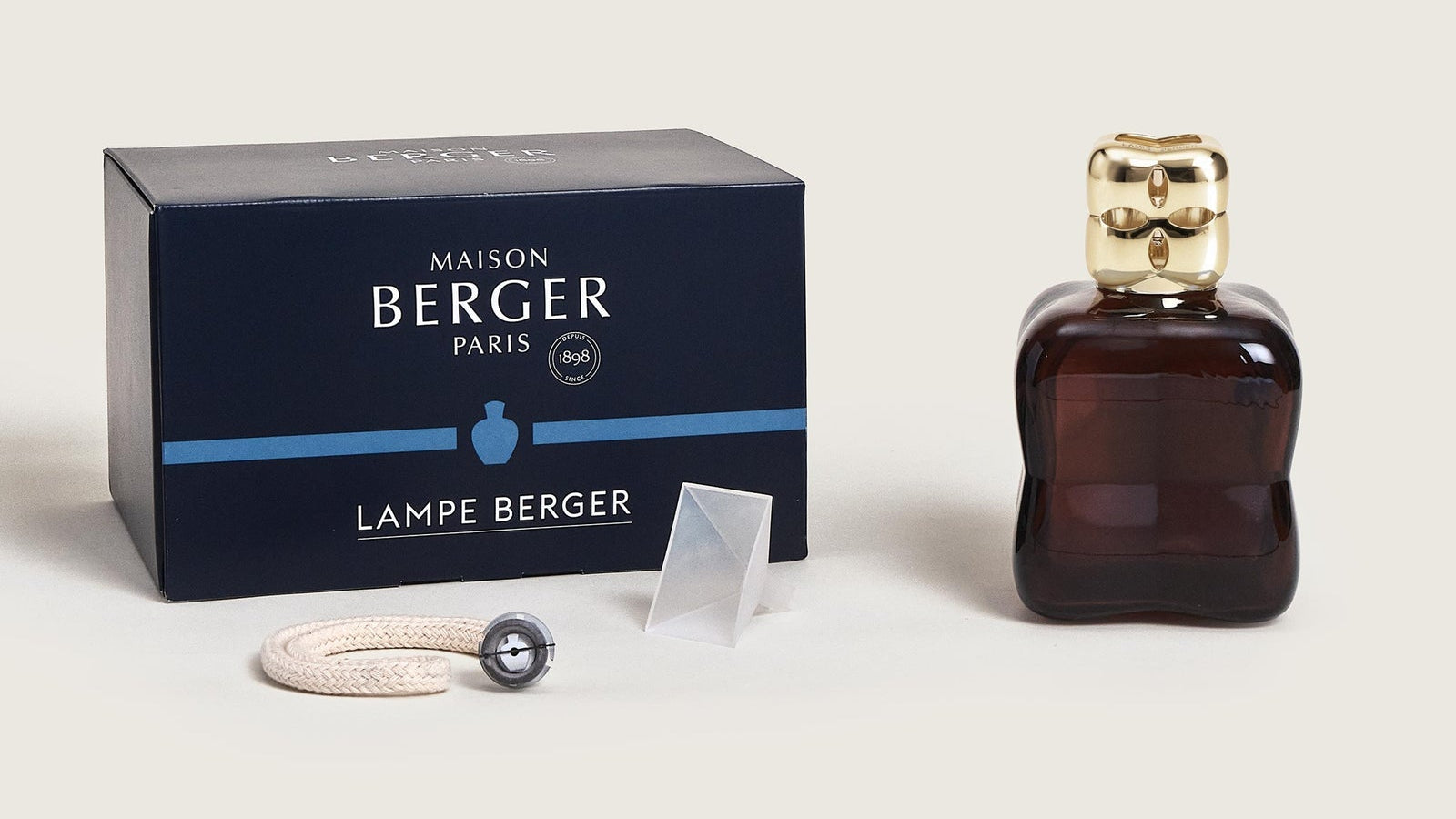 Maison Berger Paris Lampe Berger lamp and packaging on a light background